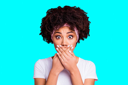 Close up photo beautiful amazing she her dark skin model lady arms hands palms hide mouth lips staring confused eyes full fear wear head scarf casual white t-shirt isolated pink bright background