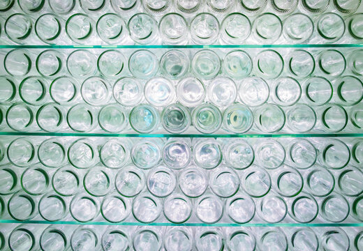 Glass Jars Arranged in Neat Rows