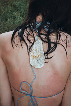 Back view anonymous woman body with natural skin