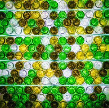 Colorful Arrangement of Glass Bottles in a Creative Display