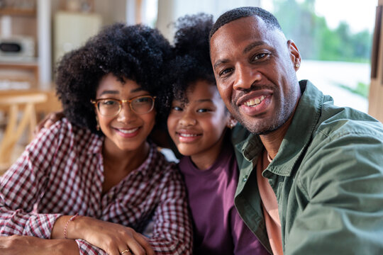 Family of three in a portrait photo