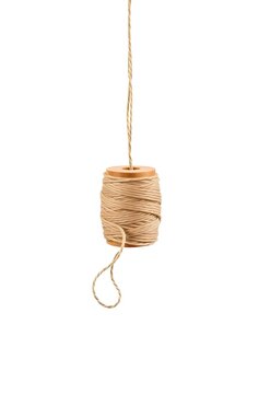 Hanging wooden spool with natural beige twine rope isolated on white background