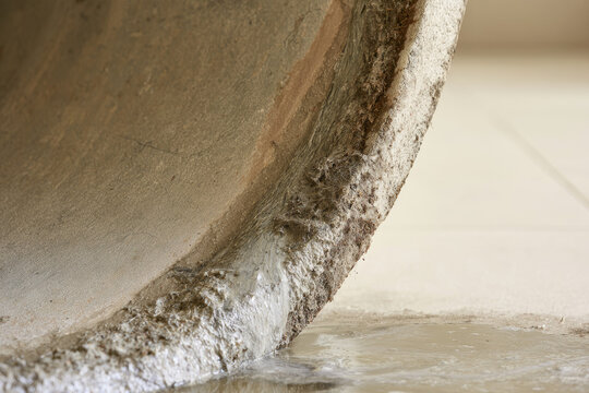 Clogged sewer line blockage extreme close up macro interior cross section of drainage pipe with calcified deposit