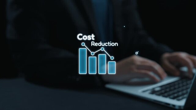 A businessman engages with a laptop displaying cost reduction graphics and financial icons, symbolizing effective budget management and strategic planning in the workplace. Qubit