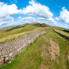 An aerial drone photograph of Hadrians Wall Path National Trail and the Pennine Way at Turret 41a near Cawfields, Northumberland, England UK © Stephen