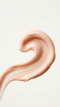 Extreme macro shot of a cosmetic cream swirl showing smooth texture and soft finish