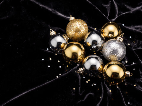 Gold and silver ornaments on black velvet