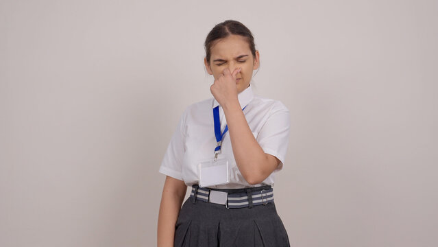 Indian Schoolgirl Covering Her Nose from Foul Smell