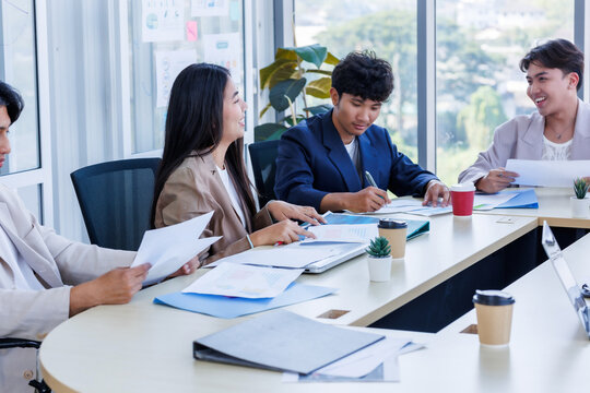 Successful happy workers Group of business people with Multiethnic workers with in company workers Group of asian business people and support Teamwork in the meeting room at modern office.