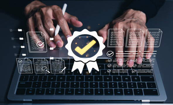 Quality assurance and compliance certification concept. Person using laptop and document checklists for verification, audit approval, standards control, review, process validation, business governance