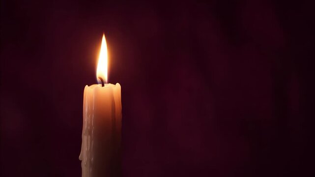Wax candle burning steadily while flickering gently against dark moody background, creating serene atmosphere