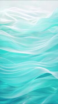 Abstract turquoise and white silk waves flowing gently in seamless motion creates dynamic texture and backdrop