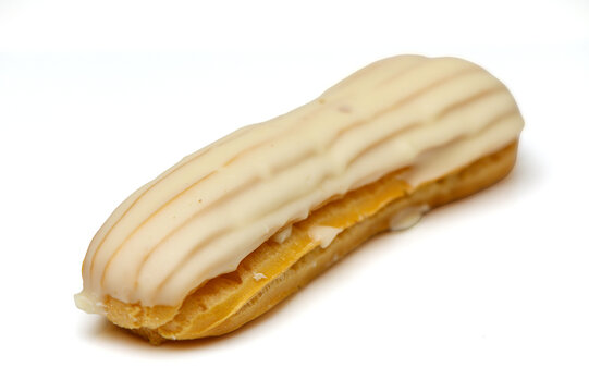 Classic white glazed eclair cake isolated on white background