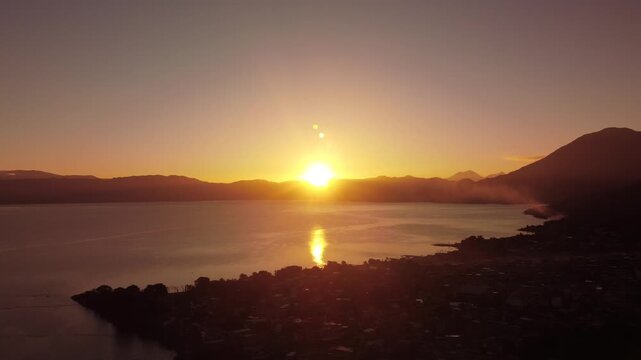 sunset over the lake Atitlan captured by drone