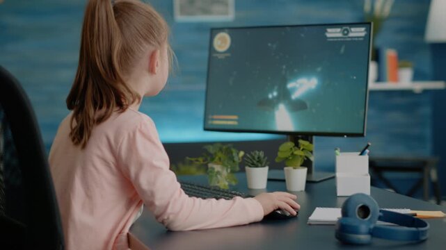 Irritation, gaming and parenting as young girl reacts when mother interrupts a computer video game at home, for screen-time limits, homework priorities, family rules and digital leisure.