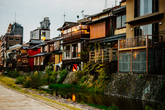 View of traditional japanese houses along Kamo-gawa river in Kyoto, Japan.