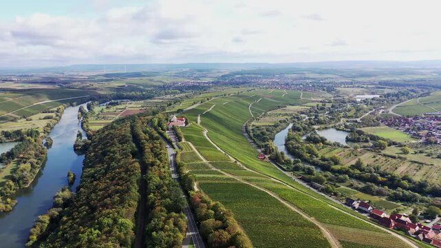 The Mainschleife near Volkach winds through the valley and is surrounded by fields and vineyards. Volkach, Kitzingen, Lower Franconia, Bavaria, Germany