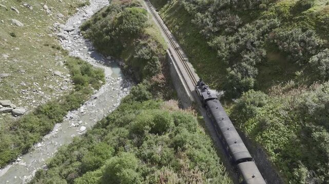 Steam railway, train with steam locomotive coming out of tunnel, Furka steam railway near Tiefenbach station, Furka Pass, Uri, Switzerland