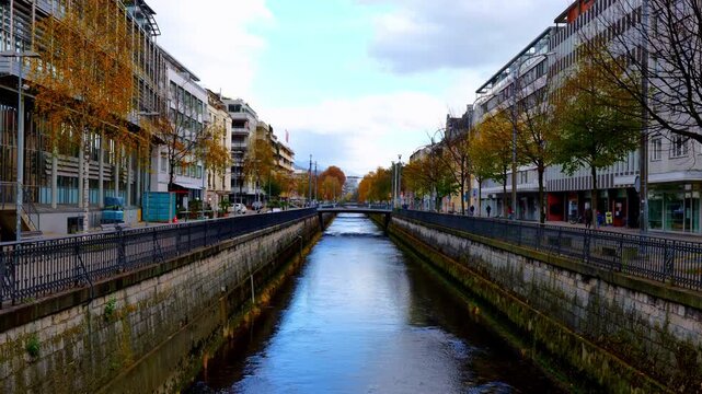 The Beautiful Suze (Sch&uuml;ss) River or Canal in Centre of the City with Building and Tree in a Sunny Autumn Day in Biel, Bienne, Canton Bern, Switzerland