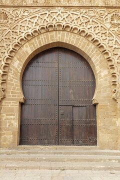 Large gate with finely detailed sandstone engravings