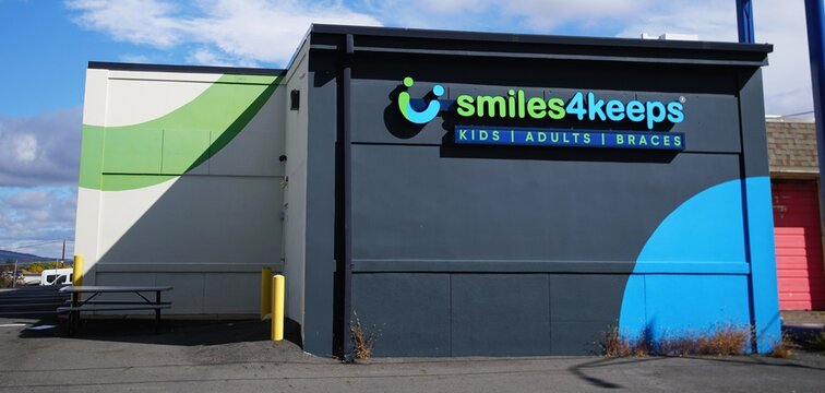 Scranton, Pennsylvania, U.S.A - Oct 17, 2026 - Exterior view of the Smiles4Keeps dental facility featuring bold blue and green wall branding.