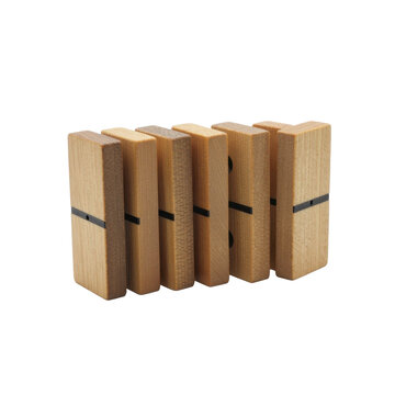 Wooden dominoes standing in a row on black background