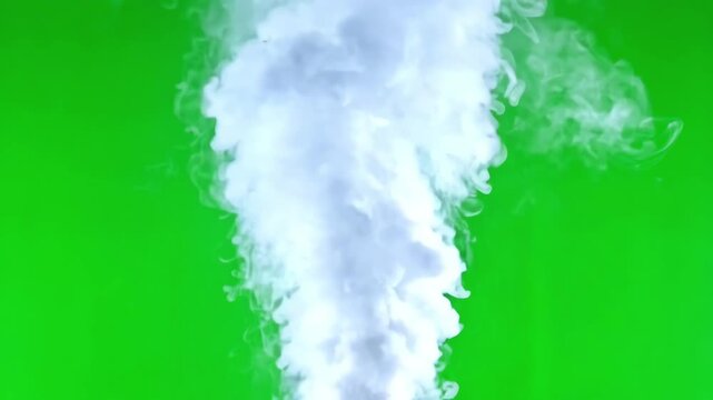 Intense steam jet blowing upwards with high pressure against a solid green screen backdrop