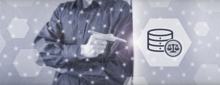 A professional man points at a database icon combined with a balance scale symbol, representing legal compliance, data governance, and regulatory framework standards.
