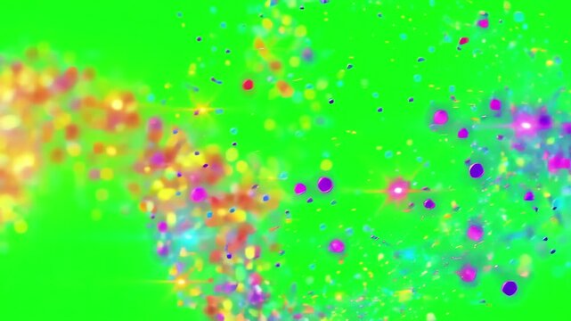 Multicolored glowing dust motes floating and dancing against a bright green screen for video compositing