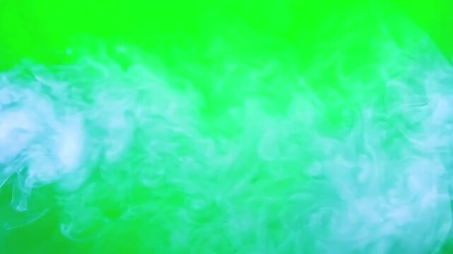Slow moving ethereal thin mist drifting horizontally across a bright green screen background for video compositing