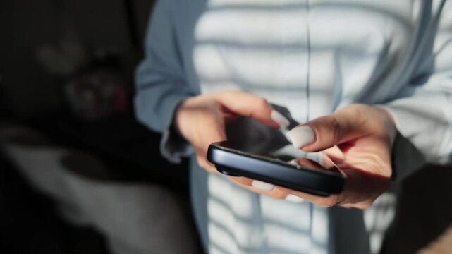Woman Hands Texting on Smartphone in Living Room at Home Online Shopping