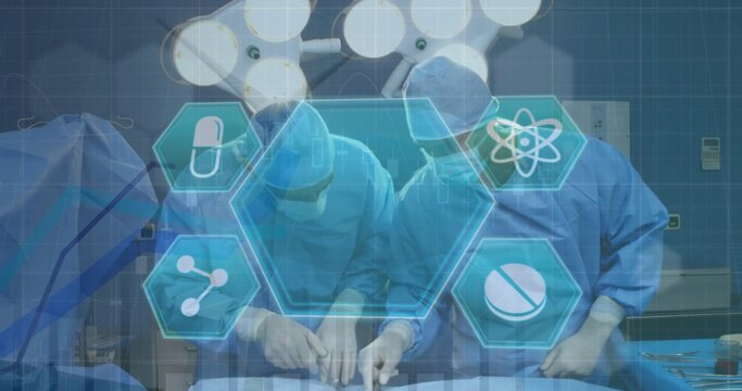 Operating surgical team wearing masks, gloves and gowns performing surgery in OR with hologram