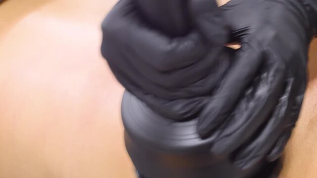 Professional body shaping therapy with vibromassage thermo vacuum and bioelectrical stimulation in beauty salon. 