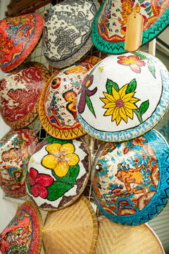 Different colorful asian hats is hanging