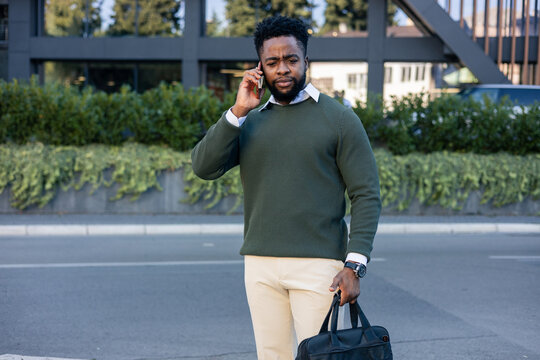 African american man talking on mobile phone in city