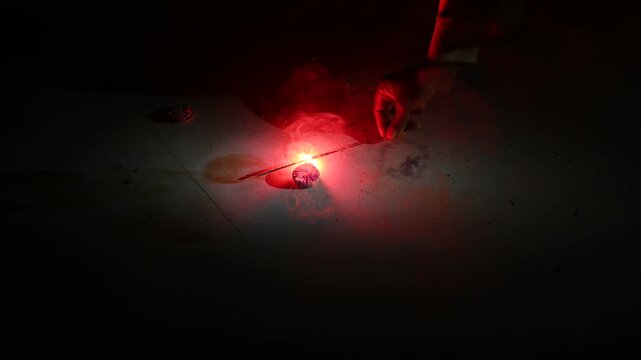A type of firecracker or chakri spinning on the ground,during the Diwali festival celebrations in India.