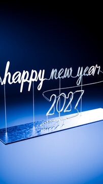 Illuminated happy new year 2027 glass light sign