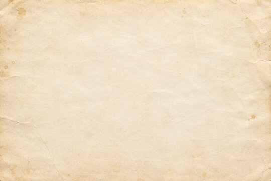 Faded antique parchment paper with stained edges