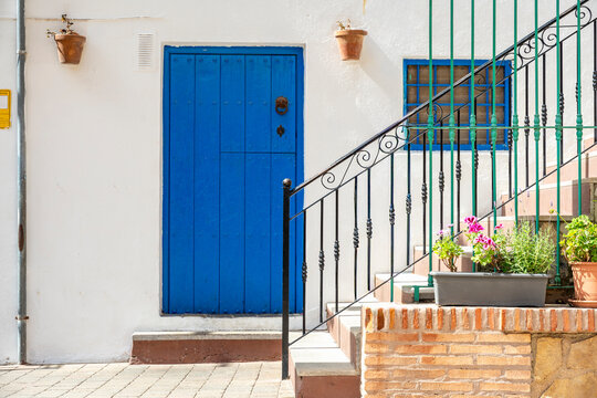 Blue Wooden Door , Staircase and Flower Pots in Mojacar, Spain