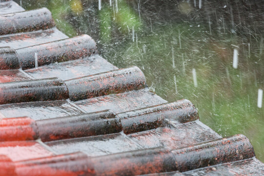 Tile roof with rain falling in Ubud Bali Indonesia Asia