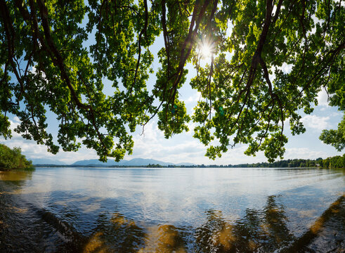 Lake Staffelsee with sunlight and mountain view near Uffing, Bavaria