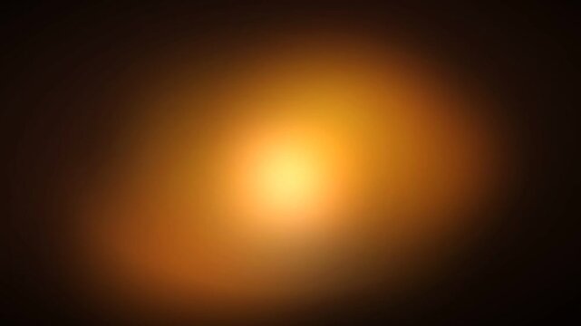 Abstract copper bronze light glow moving slowly on a dark blurred background