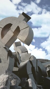 Vertical video: Camera tilting revealing stone dollar sign centering against sky to show collapse