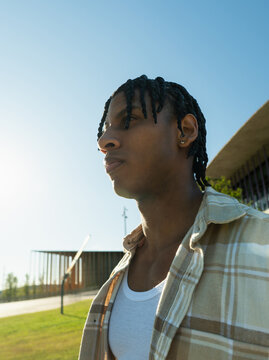 Young cuban man looking away with determination