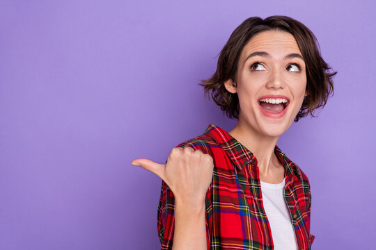 Photo of impressed millennial bob hairdo lady look promo wear plaid shirt isolated on purple color background