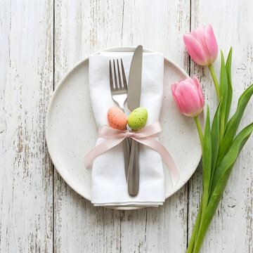 Elegant Easter Table Setting with Pink Tulips and Speckled Eggs