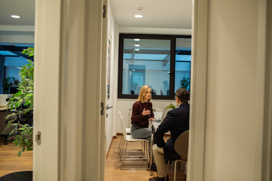 Woman leading one-on-one meeting in office