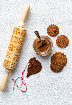 Biscoff biscuits embossed with patterned rolling pin and spice jar