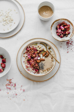 Porridge with pistachios, almonds, chia seeds, rose petals