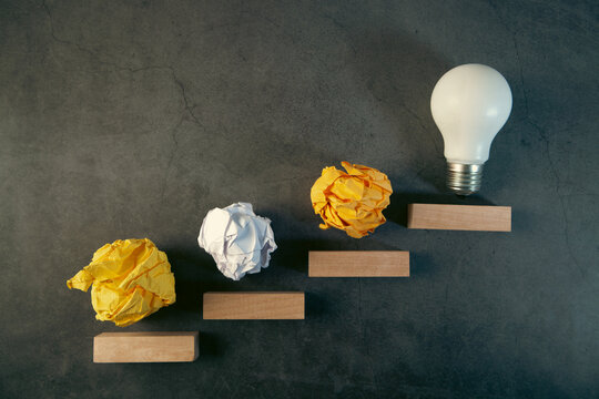 Conceptual image of crumpled paper and lightbulb